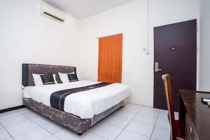 Imagen de la habitación del Hotel OYO 2695 D\'es Guest House. Foto 9