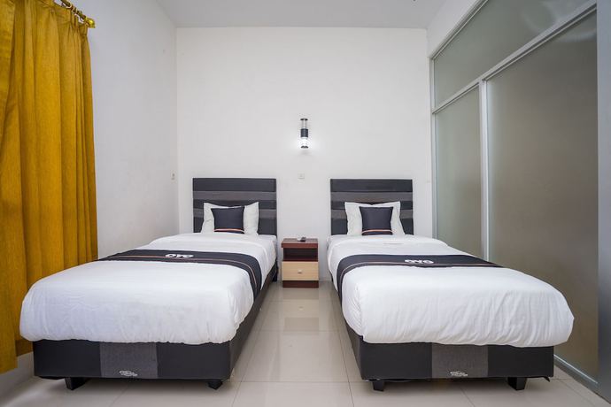 Imagen de la habitación del Hotel OYO 2695 D\'es Guest House. Foto 11