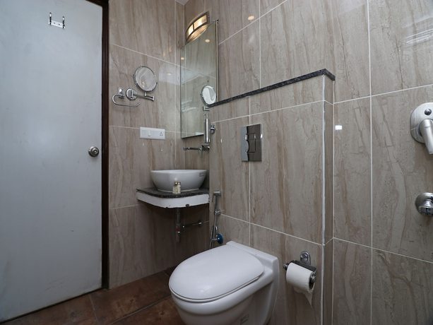 Imagen de la habitación del Hotel OYO 27054 New Sundaram. Foto 6