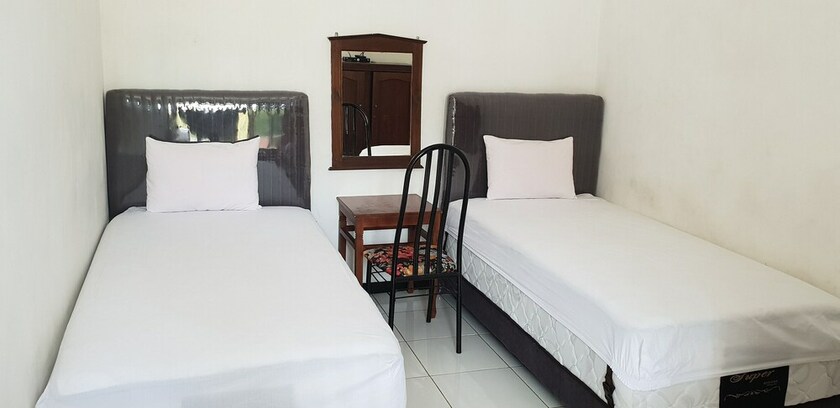 Imagen de la habitación del Hotel OYO 2753 Irma\'s Residence. Foto 19