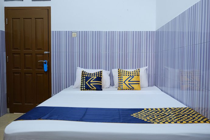 Imagen de la habitación del Hotel OYO 2766 Kezia Kost. Foto 3