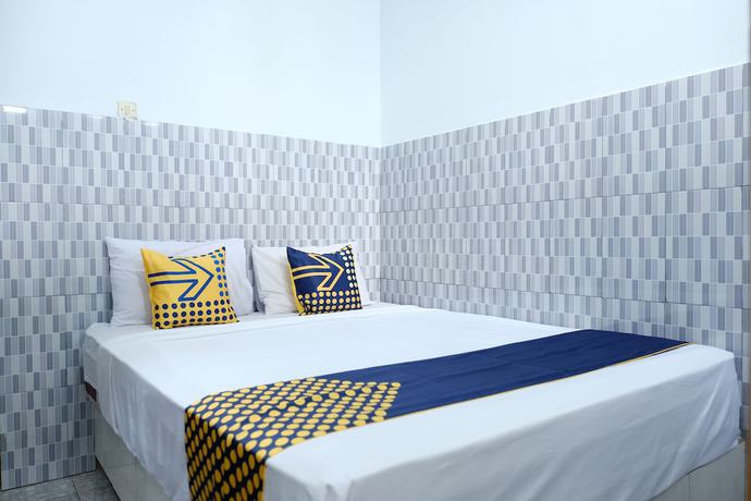 Imagen de la habitación del Hotel OYO 2766 Kezia Kost. Foto 4