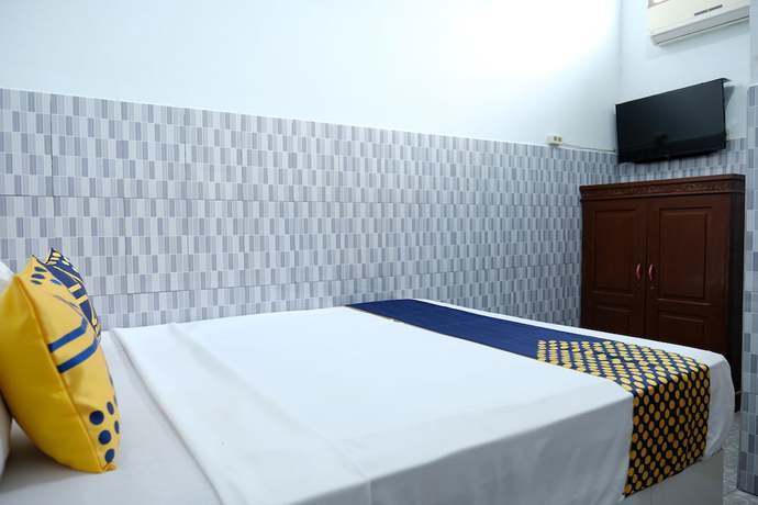 Imagen de la habitación del Hotel OYO 2766 Kezia Kost. Foto 8