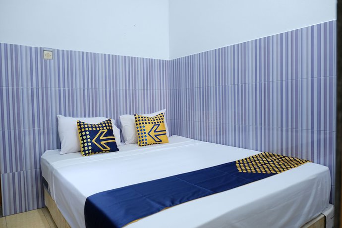 Imagen de la habitación del Hotel OYO 2766 Kezia Kost. Foto 9