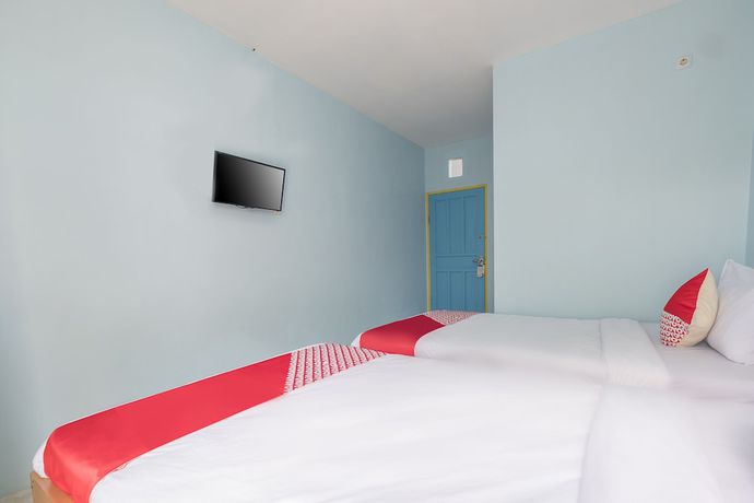 Imagen de la habitación del Hotel OYO 2775 RF Homestay. Foto 5
