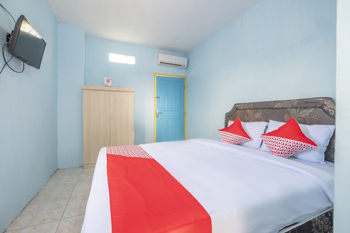 Imagen de la habitación del Hotel OYO 2775 RF Homestay. Foto 8