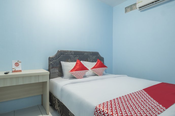 Imagen de la habitación del Hotel OYO 2775 RF Homestay. Foto 12