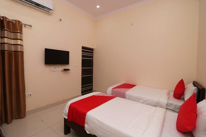 Imagen de la habitación del Hotel OYO 27941 Sangam Darshan. Foto 13