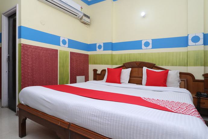 Imagen de la habitación del Hotel OYO 30100 Lucky Guest House. Foto 2