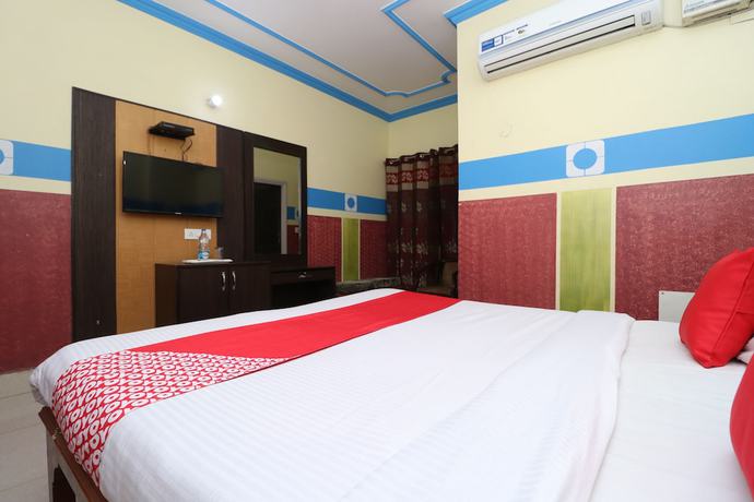 Imagen de la habitación del Hotel OYO 30100 Lucky Guest House. Foto 5
