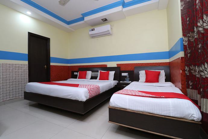 Imagen de la habitación del Hotel OYO 30100 Lucky Guest House. Foto 6