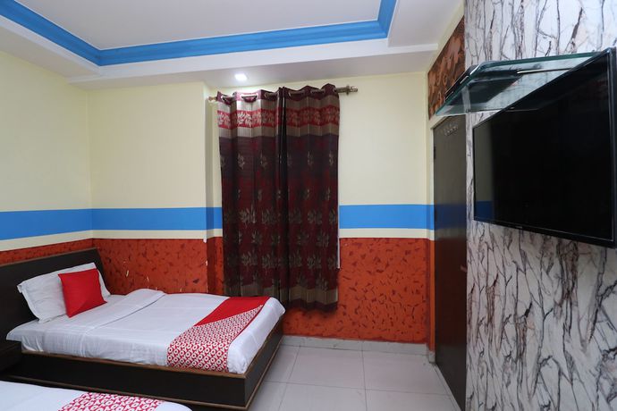 Imagen de la habitación del Hotel OYO 30100 Lucky Guest House. Foto 7