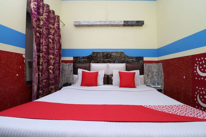 Imagen de la habitación del Hotel OYO 30100 Lucky Guest House. Foto 9