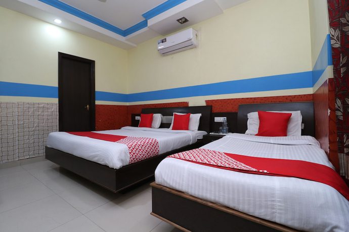 Imagen de la habitación del Hotel OYO 30100 Lucky Guest House. Foto 13