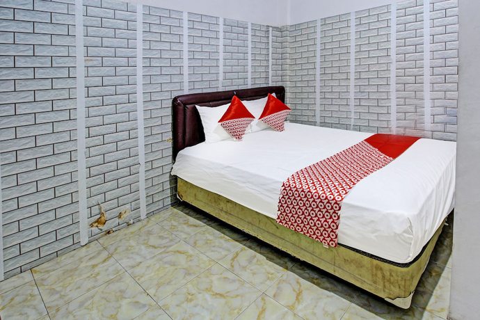 Imagen de la habitación del Hotel OYO 3012 Coupis Guesthouse Syariah. Foto 2