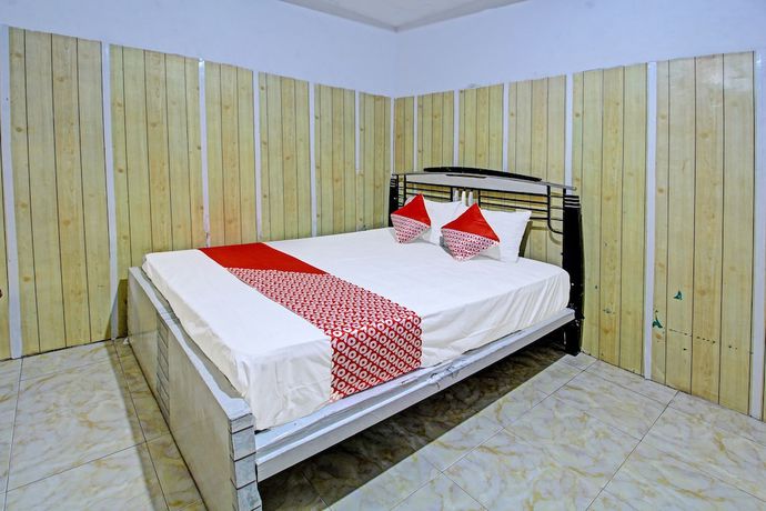 Imagen de la habitación del Hotel OYO 3012 Coupis Guesthouse Syariah. Foto 3
