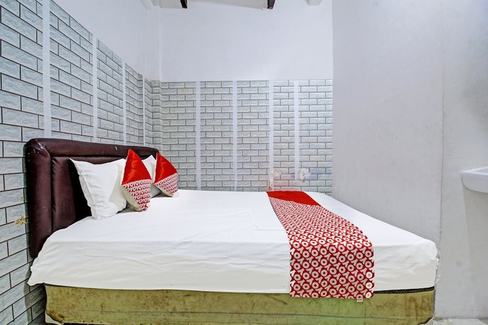 Imagen de la habitación del Hotel OYO 3012 Coupis Guesthouse Syariah. Foto 4