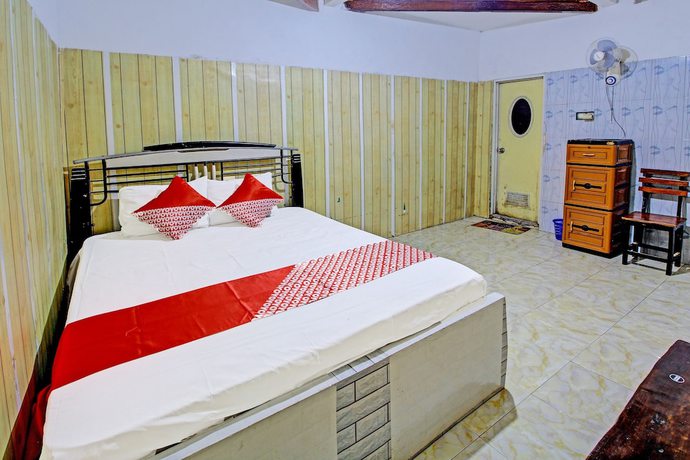 Imagen de la habitación del Hotel OYO 3012 Coupis Guesthouse Syariah. Foto 5