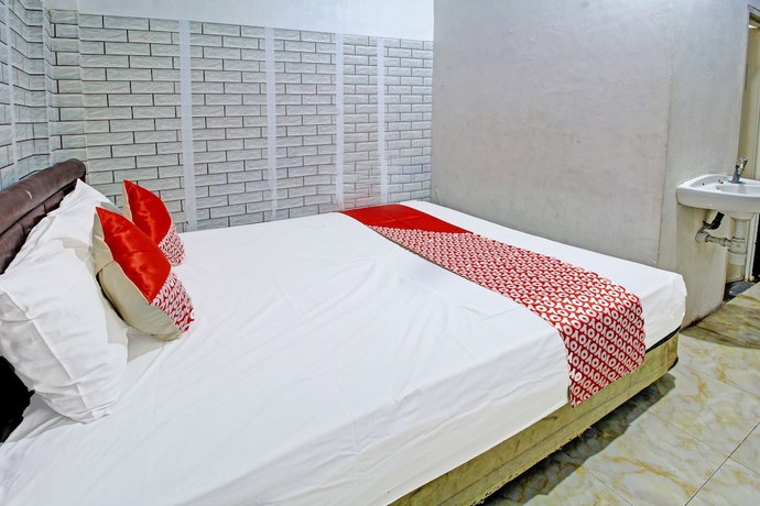 Imagen de la habitación del Hotel OYO 3012 Coupis Guesthouse Syariah. Foto 8