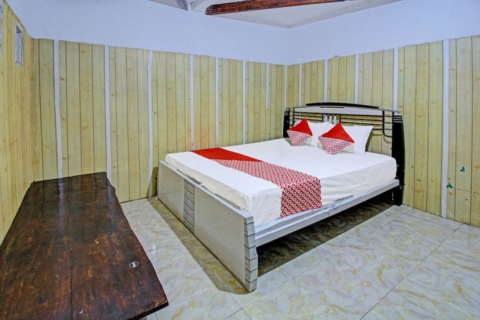 Imagen de la habitación del Hotel OYO 3012 Coupis Guesthouse Syariah. Foto 12