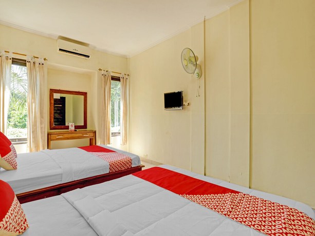 Imagen de la habitación del Hotel OYO 3062 Pondok Wisata Dewata. Foto 9