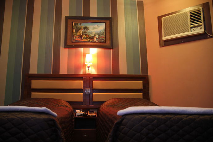 Imagen de la habitación del Hotel OYO 329 Down Town. Foto 10