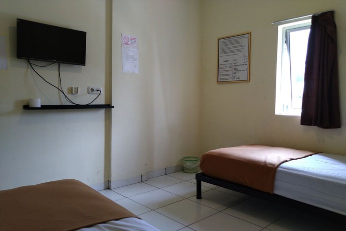 Imagen de la habitación del Hotel OYO 3499 J8. Foto 11