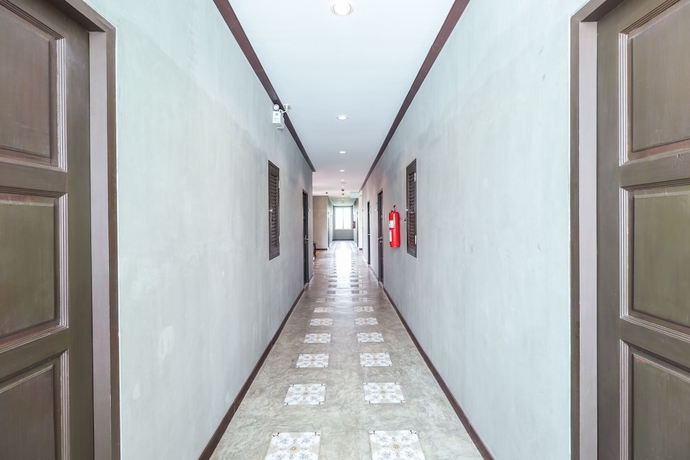Imagen de los interiores del Hotel OYO 360 De Phunchai Hometel Lamphun. Foto 16