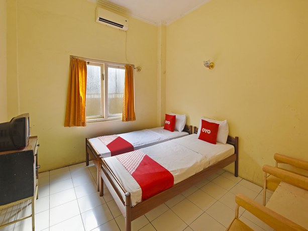 Imagen de la habitación del Hotel OYO 3722 Mutiara. Foto 4