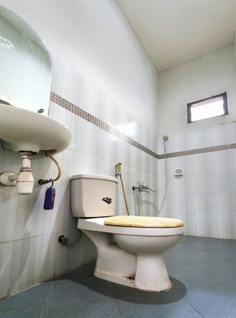 Imagen de la habitación del Hotel OYO 3762 Wisma Focus. Foto 9