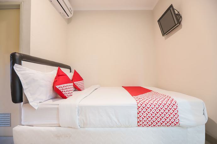 Imagen de la habitación del Hotel OYO 387 Alfa Guest House. Foto 3