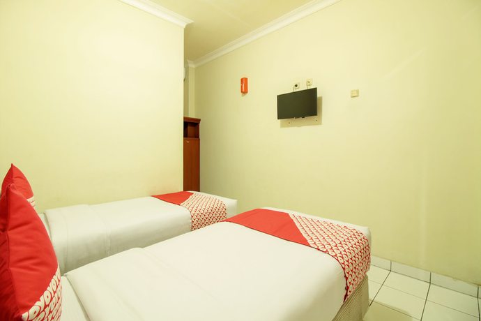Imagen de la habitación del Hotel OYO 387 Alfa Guest House. Foto 4