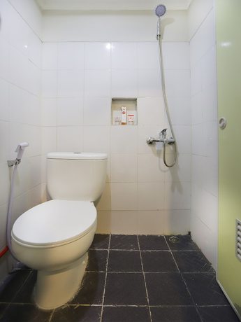 Imagen de la habitación del Hotel OYO 387 Alfa Guest House. Foto 5