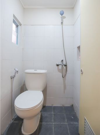 Imagen de la habitación del Hotel OYO 387 Alfa Guest House. Foto 6