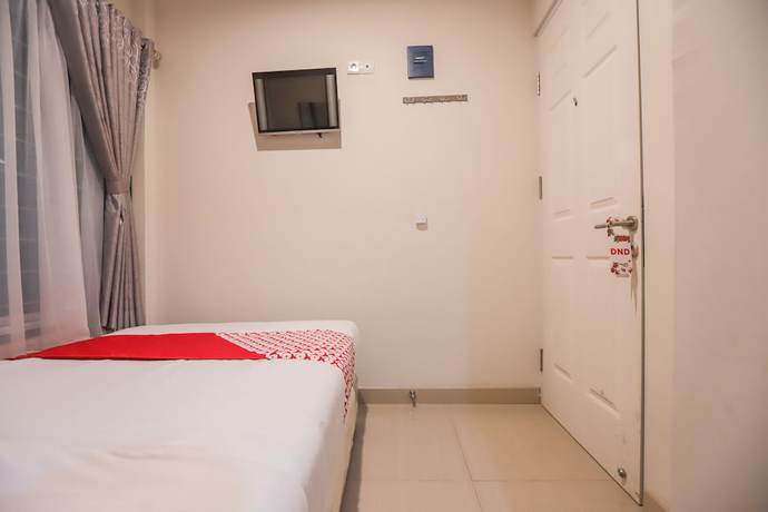 Imagen de la habitación del Hotel OYO 387 Alfa Guest House. Foto 8