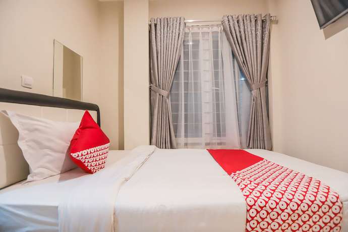 Imagen de la habitación del Hotel OYO 387 Alfa Guest House. Foto 9