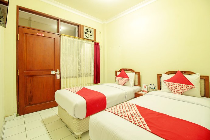Imagen de la habitación del Hotel OYO 387 Alfa Guest House. Foto 10