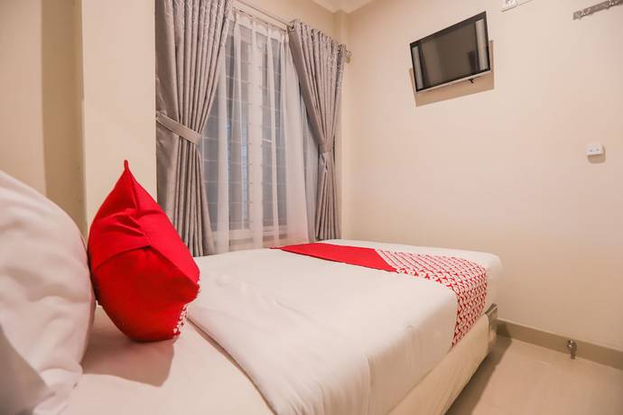 Imagen de la habitación del Hotel OYO 387 Alfa Guest House. Foto 11