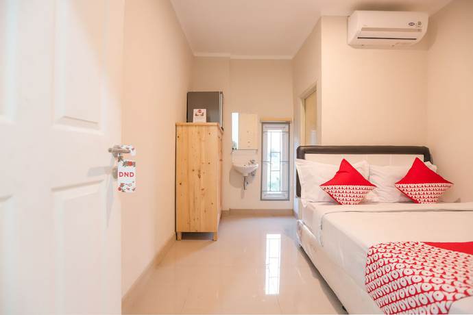 Imagen de la habitación del Hotel OYO 387 Alfa Guest House. Foto 12