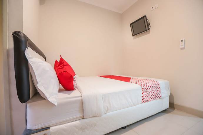 Imagen de la habitación del Hotel OYO 387 Alfa Guest House. Foto 13