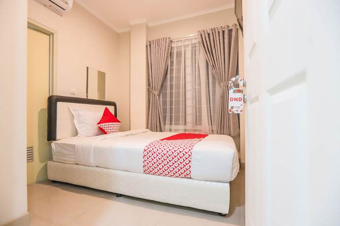 Imagen de la habitación del Hotel OYO 387 Alfa Guest House. Foto 14