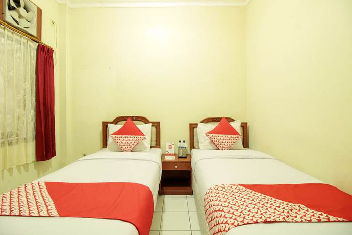 Imagen de la habitación del Hotel OYO 387 Alfa Guest House. Foto 15