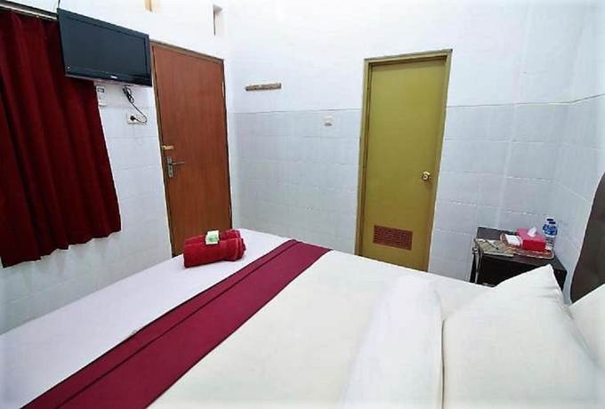 Imagen de la habitación del Hotel OYO 418 Setra House. Foto 3