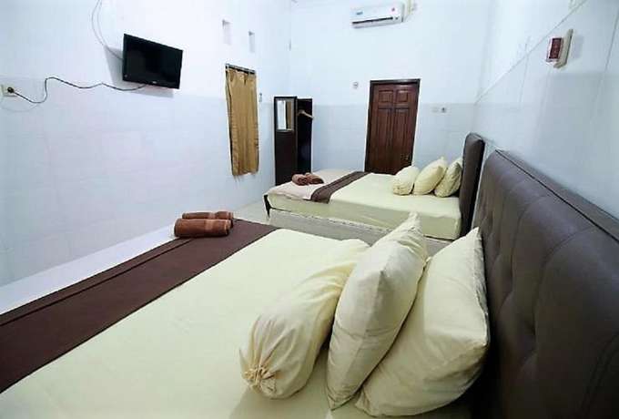 Imagen de la habitación del Hotel OYO 418 Setra House. Foto 4