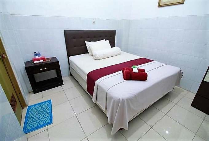 Imagen de la habitación del Hotel OYO 418 Setra House. Foto 5