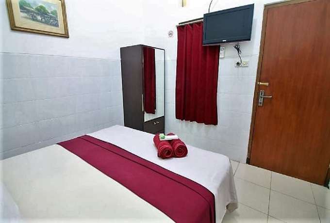 Imagen de la habitación del Hotel OYO 418 Setra House. Foto 6