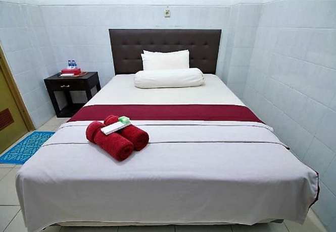 Imagen de la habitación del Hotel OYO 418 Setra House. Foto 9