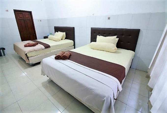 Imagen de la habitación del Hotel OYO 418 Setra House. Foto 10