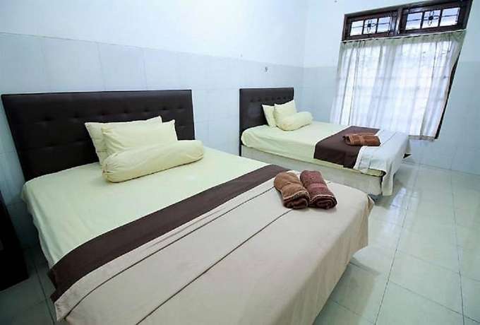 Imagen de la habitación del Hotel OYO 418 Setra House. Foto 13