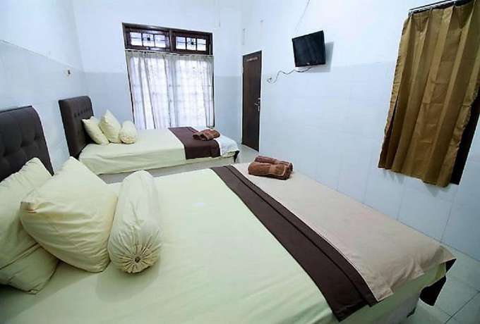 Imagen de la habitación del Hotel OYO 418 Setra House. Foto 15
